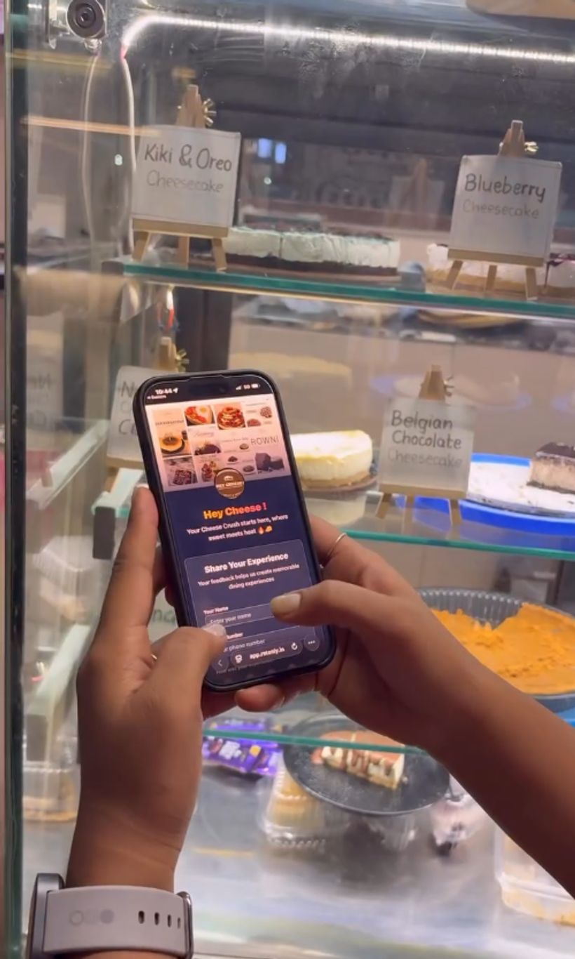 A customer filling the Retenly form on a phone at Hey Cheese